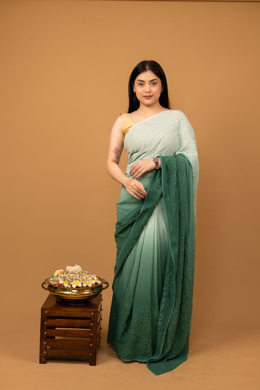 Lady wearing Ombre Green Viscose Georgette Saree with Mukeish work front view