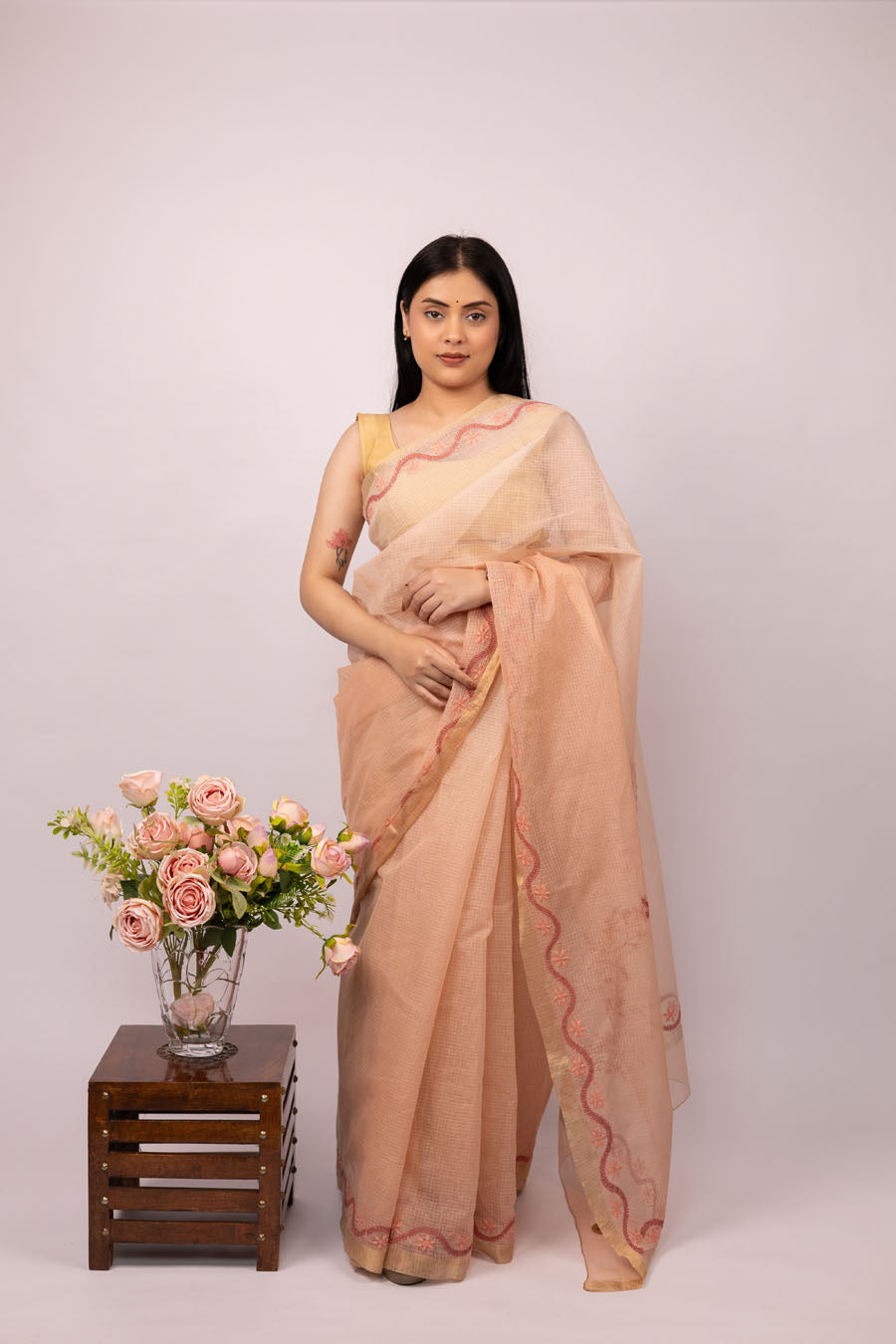 Women wearing Blush Peach Kotadoriya Cotton Saree with Delicate Chikankari bootas perfect for the summers