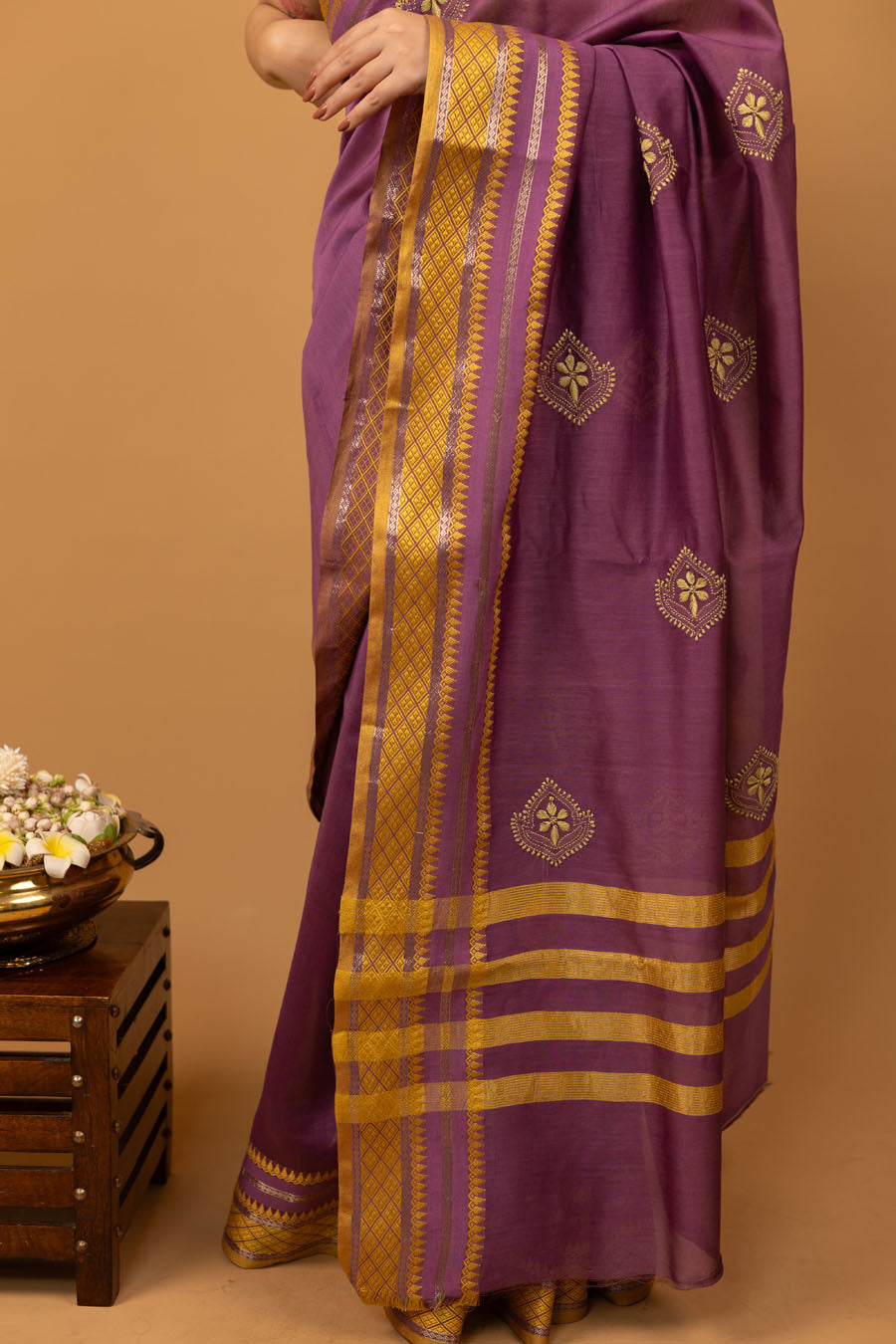 Pallu of Purple Mangalgiri Chikankari saree with golden zari and resham border and yellow embroidery