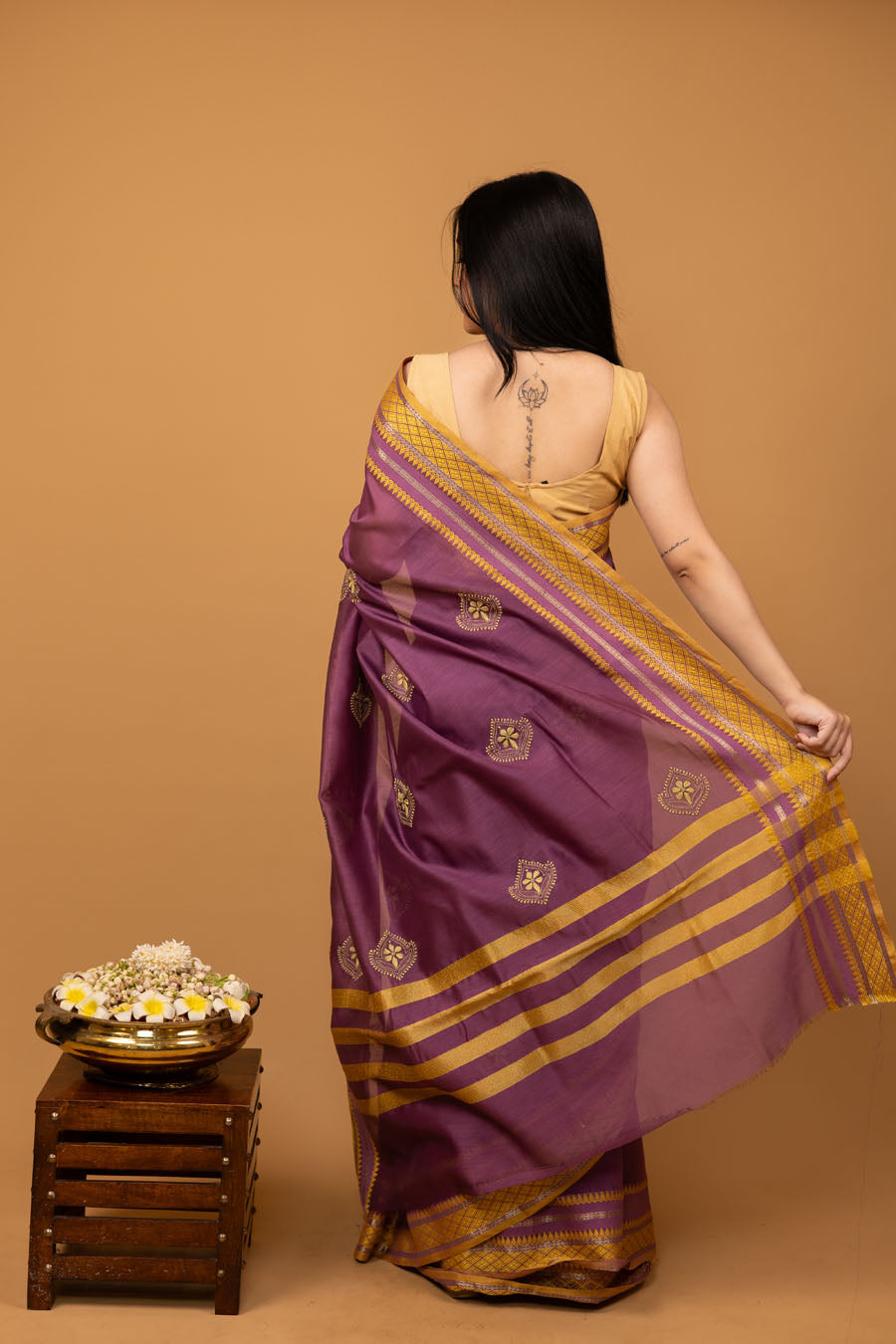 Back view of Purple Mangalgiri Chikankari saree with golden zari and resham border and yellow embroidery