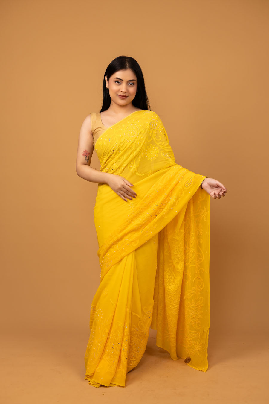 Front view of Yellow Viscose georgette saree with embellishments