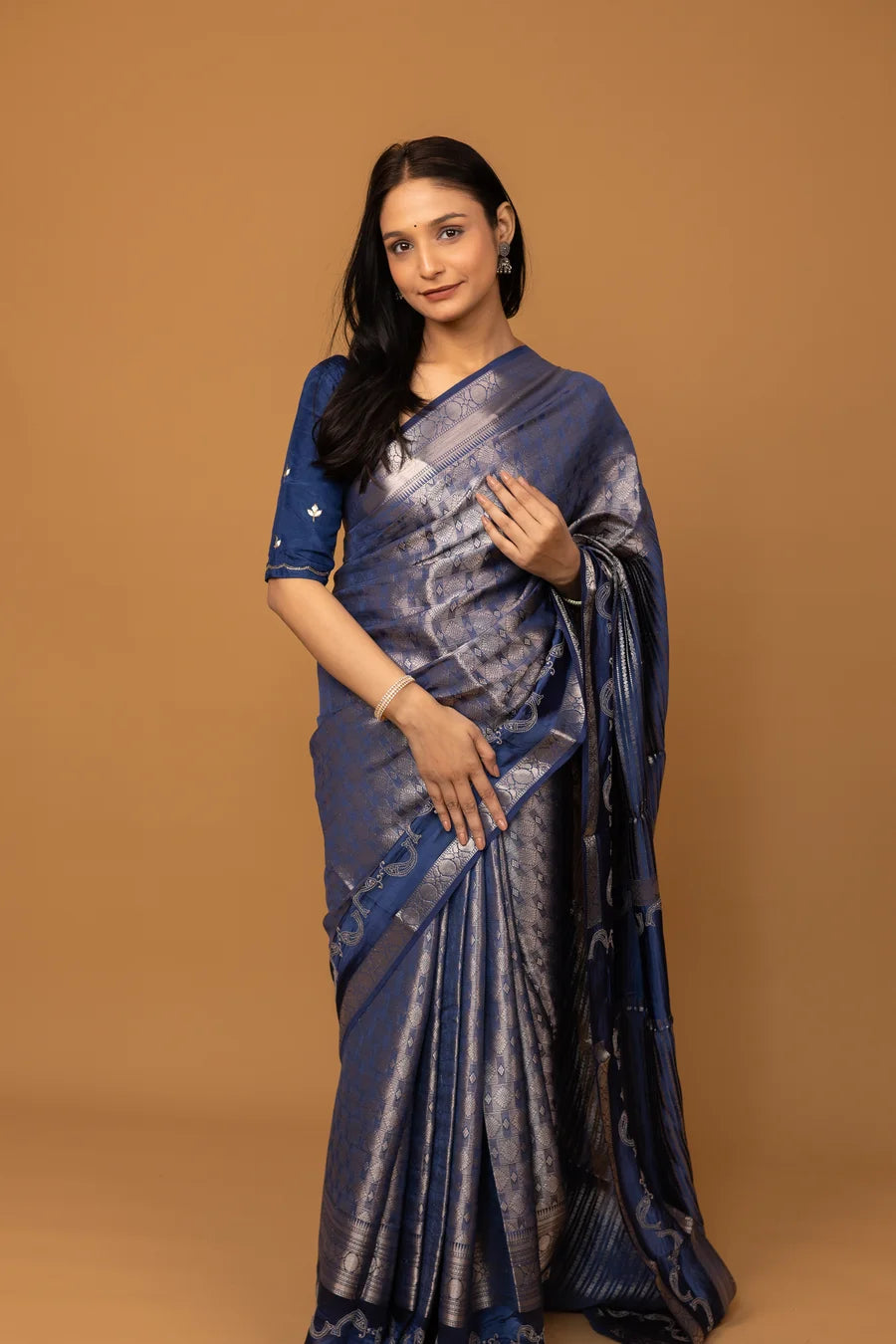 Navy blue silk saree with silver zari weaving and designer border