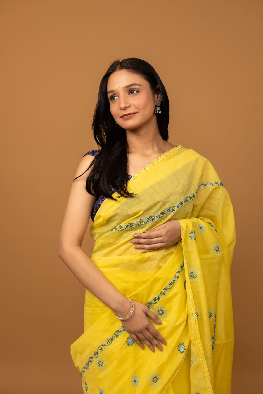 Full look of lightweight yellow chikankari saree with elegant embroidered border